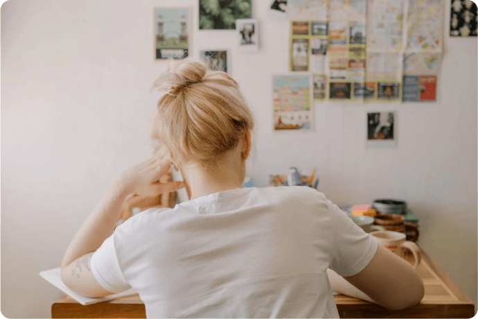 A young woman studying at her desk